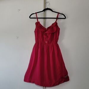 Hollister mini vibrant cerise babydoll dress with ruffles and buttons.